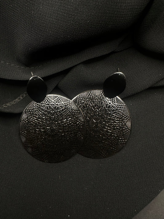 Black circle earrings with design inside